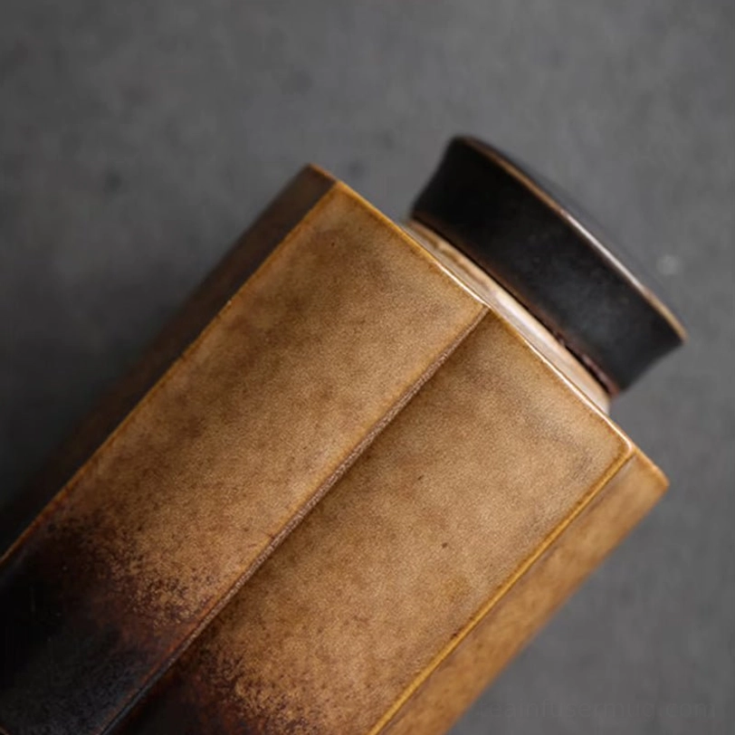 side view of faceted ceramic tea storage canister