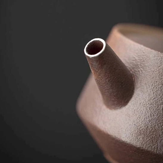 top view of faraway mountain teapot with infuser showing lid and opening