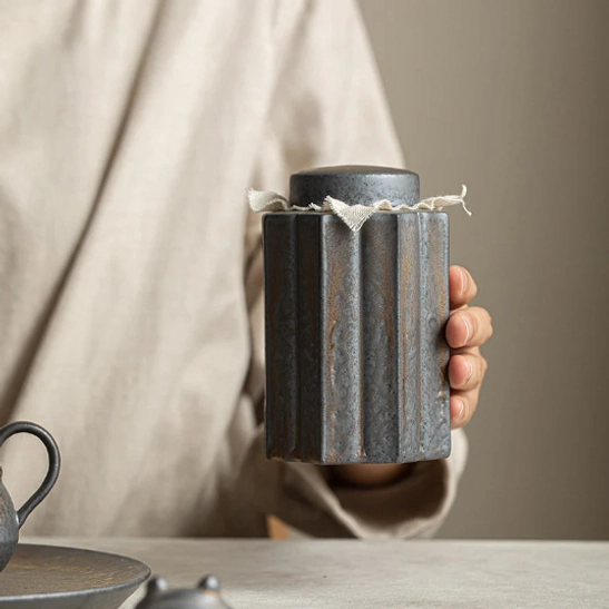 side view of fluted 8-sided ceramic tea storage canister