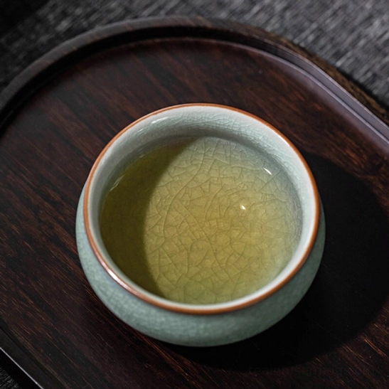 four styles of ru kiln ice crackle tea cups grouped together