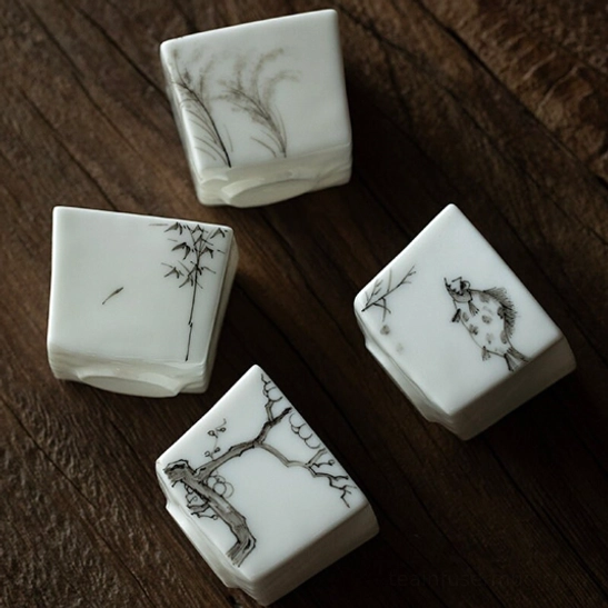 Four styles of 50ml ink wash square Chinese tea cups arranged