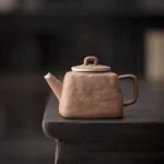 front view of 200ml old clay teapot with silver accent