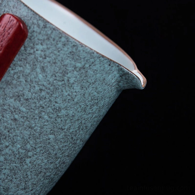 teapot and four teacups of green travel tea set arranged outside case