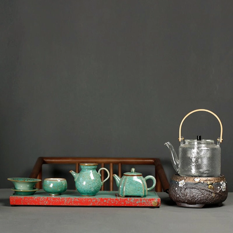 full set of matching green speckled ceramic tea ware including elephant teapot