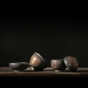 Full set of four handcrafted gilded clay tea bowls showing all size options