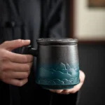 full view of black-green gradient 15oz ceramic tea infuser mug with lid