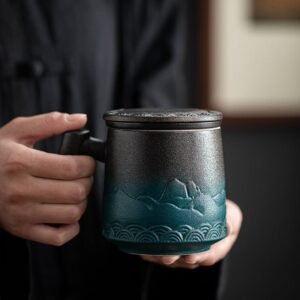 full view of black-green gradient giant ceramic tea mug with infuser and lid