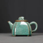 full view of 250ml green elephant knob ceramic teapot with infuser