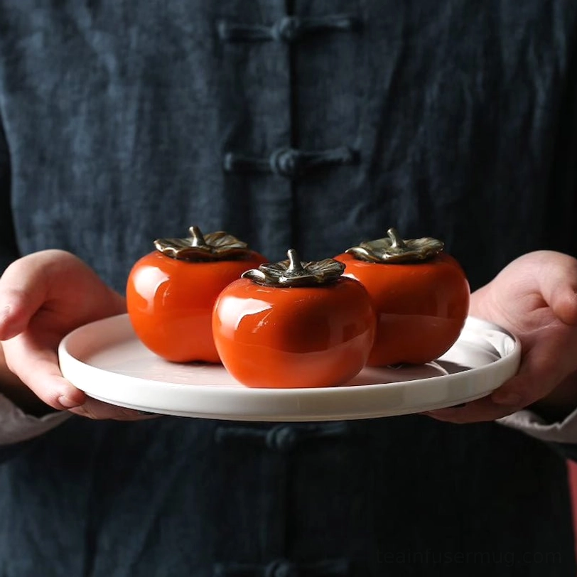 full view of persimmon shaped orange ceramic tea storage canister