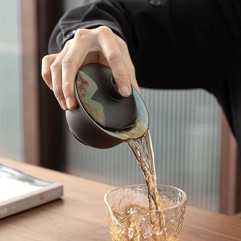 demonstration of controlled pouring with traditional gaiwan