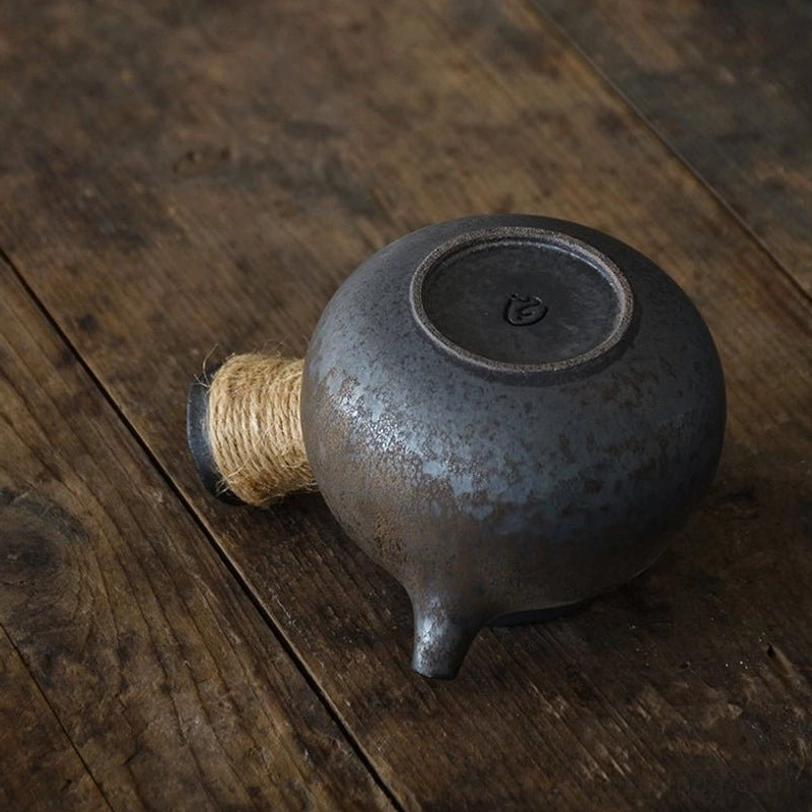 top view of open gilded ceramic kyusu teapot with infuser