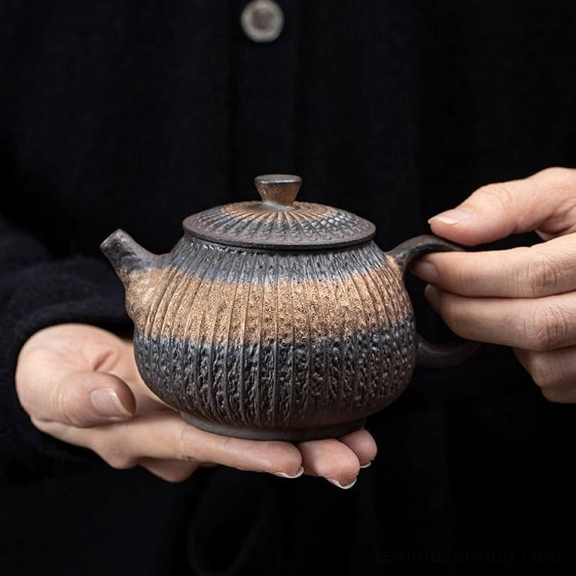front view of 250ml gilded iron glaze ceramic teapot with infuser