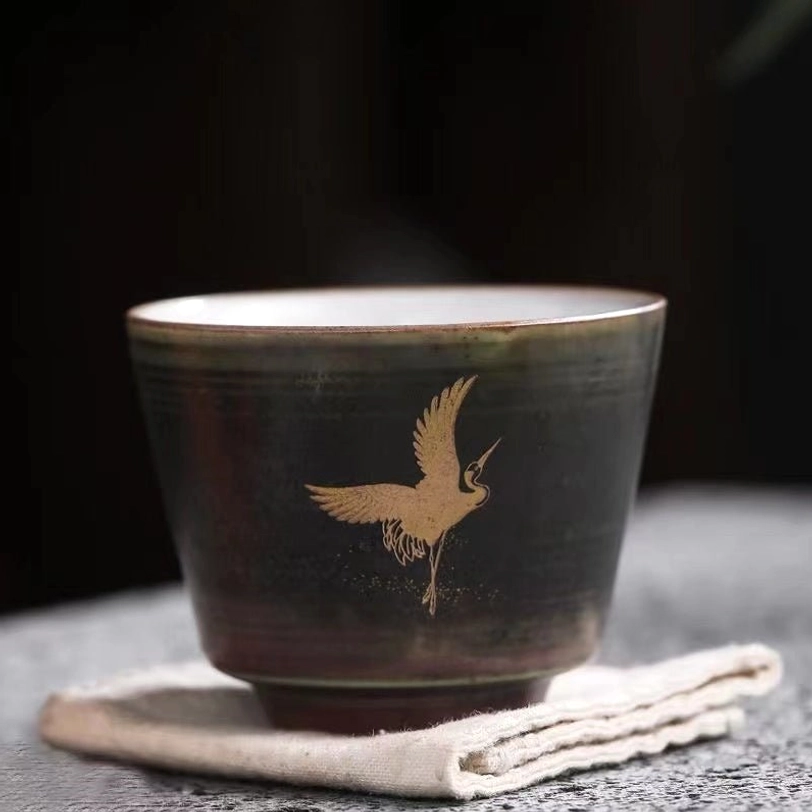 top view of 90ml gold crane chinese ceramic tea cup showing white interior
