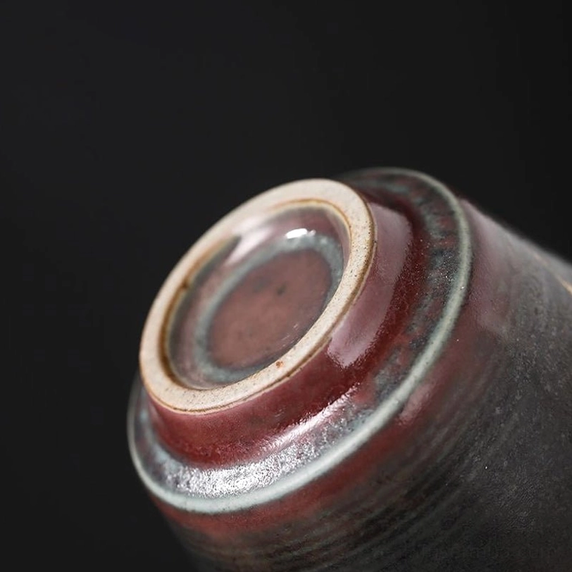 gold crane pattern close up on chinese ceramic tea cup