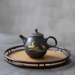 full view of golden crane design black ceramic teapot with infuser 230ml