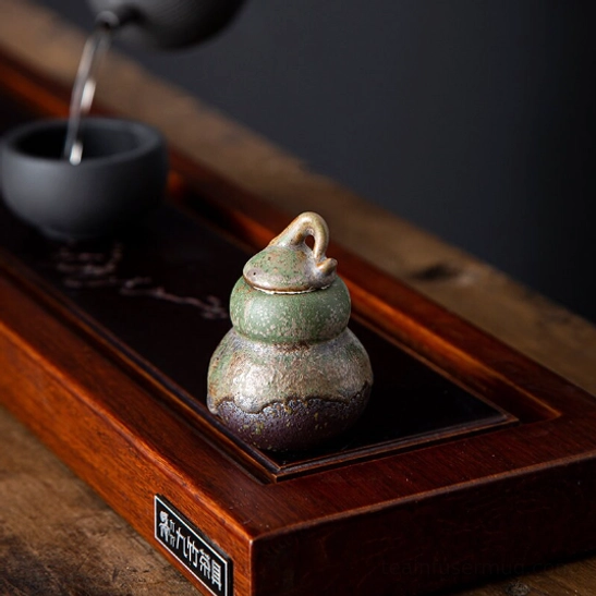 gourd tea canister placed on wooden tea table for tea ceremony