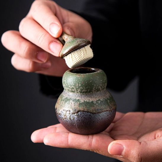 side view of rustic kiln finish gourd tea canister