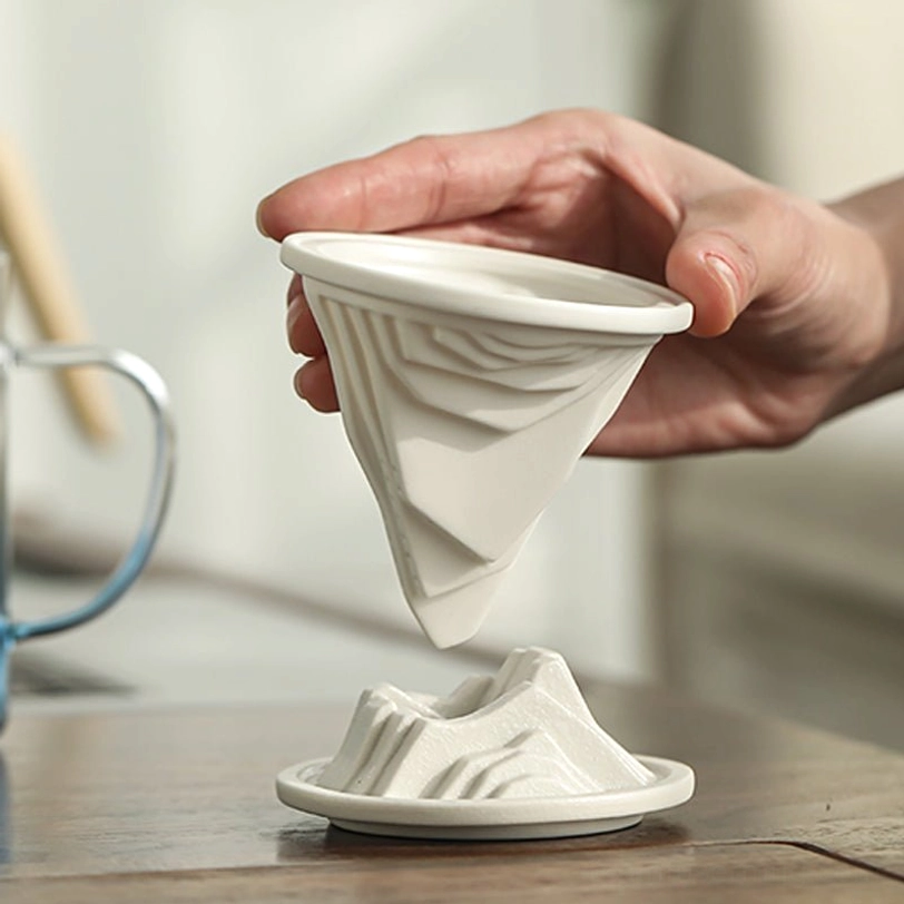 translucent gradient blue glass body of mountain tea infuser mug with handle