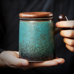 gradient green crackle glazed ceramic tea mug with infuser and wooden lid full view