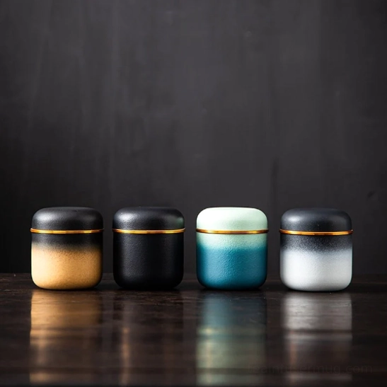 gradient tea storage canister placed on modern home tea table