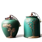 turquoise green ceramic tea storage canister with relief pine pattern