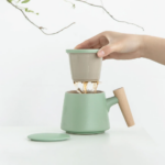 full assembled 300ml green ceramic tea strainer mug with wooden handle