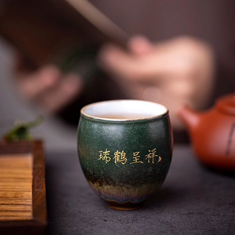 side view of green vintage chinese ceramic crane tea cup showing rui he cheng xiang inscription