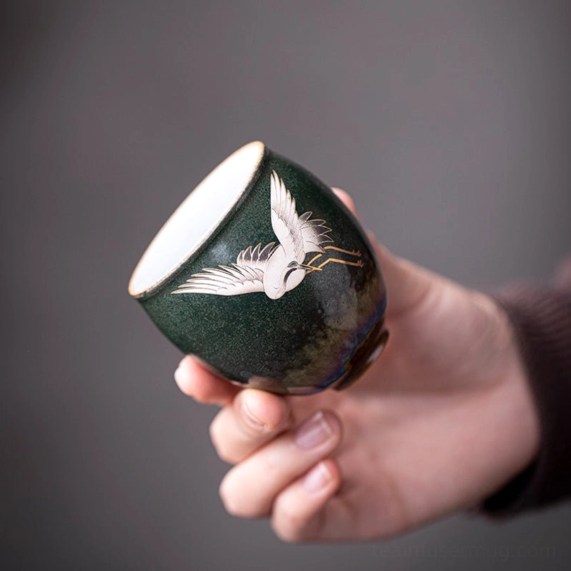 top view of green vintage chinese ceramic crane tea cup