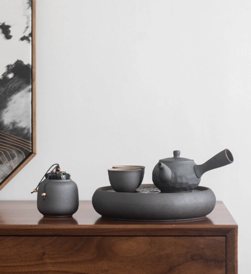 subtle hammered texture surface detail on dark gray kyusu teapot