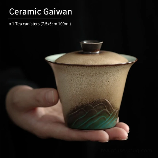 hand holding mountain ceramic gaiwan demonstrating pouring position