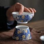 Hand-painted small ceramic tea strainer with traditional Chinese pattern main view