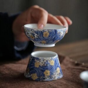 Hand-painted small ceramic tea strainer with traditional Chinese pattern main view