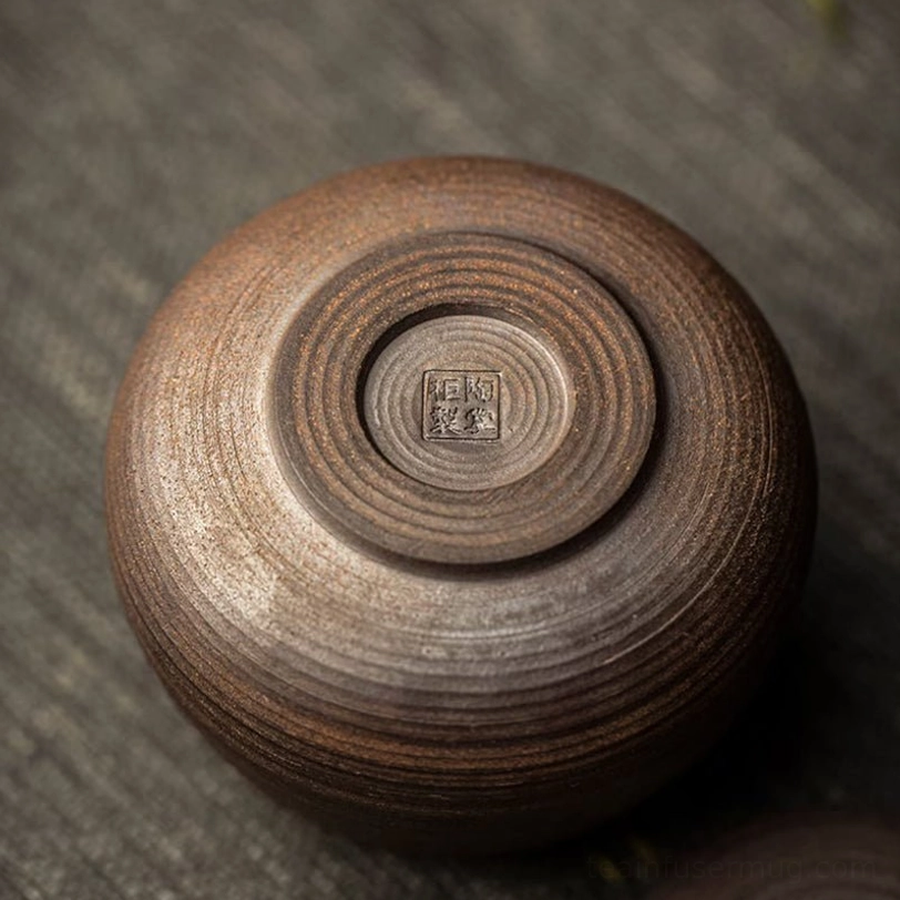 close up of hand-thrown texture on ceramic tea storage canister body
