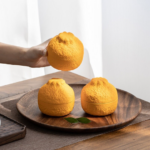 closed handcrafted ceramic orange tea strainer full closed view