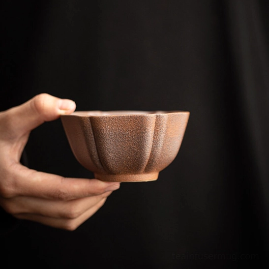 top view showing inner floral pattern of japanese clay tea cup