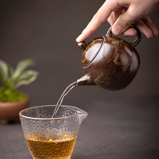 japanese clay teapot styled on minimalist tea table for home brewing