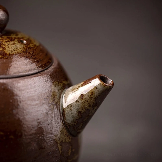 japanese clay teapot pouring clear brewed tea