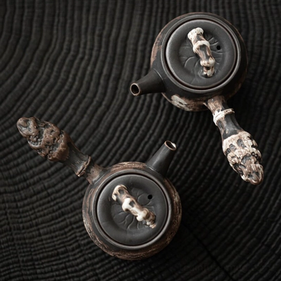 japanese kyusu ceramic teapot on neutral background