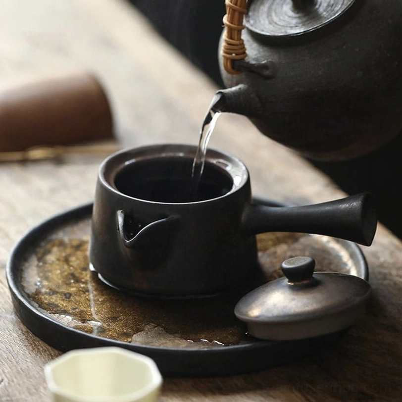close up of the rustic mottled surface on 120ml japanese kyusu teapot