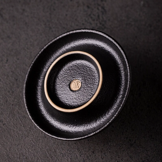 Top view looking into the light beige interior of the 50ml Japanese tea cup