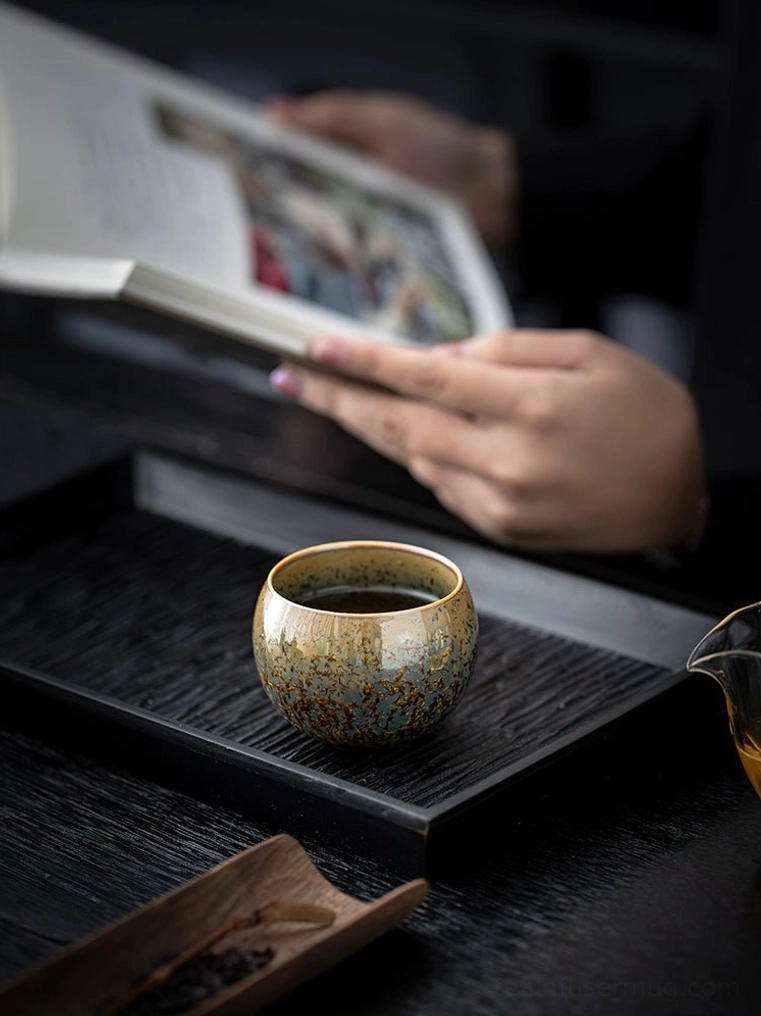 top view of 145ml jian zhan kiln change tea cup with gold rim