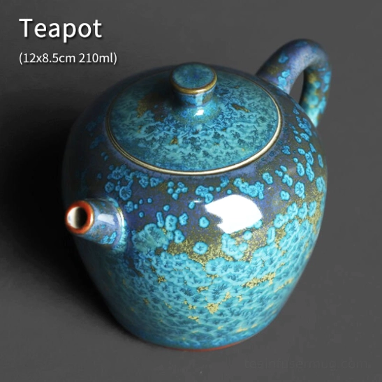 close up of the unique kiln glazed surface of jun kiln turquoise blue teapot