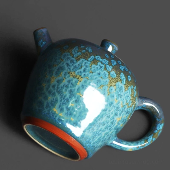 side view showing ergonomic handle and spout of jun kiln turquoise teapot