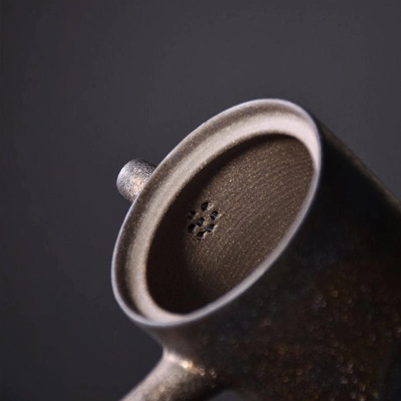 close up of mottled kiln change texture on ceramic kyusu teapot