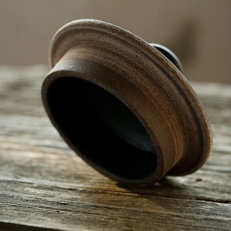 vintage textured glaze detail on dark kyusu teapot body