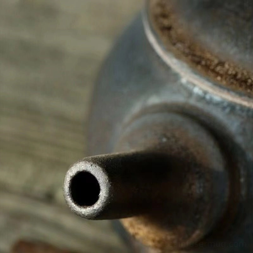 close up of the flared side handle of the ceramic kyusu teapot