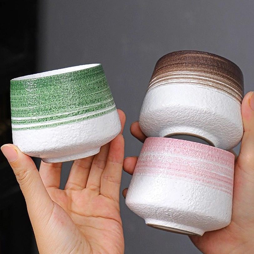 leaf latte art coffee in green large ceramic tea cup