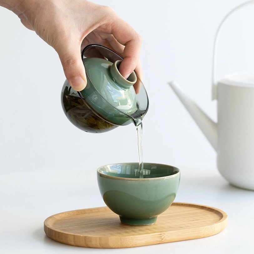 Glass gaiwan of Longquan celadon travel tea set showing ceramic and glass design