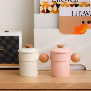 full product view of beige kaolin ceramic tea infuser mug with strainer, lid and wood handle