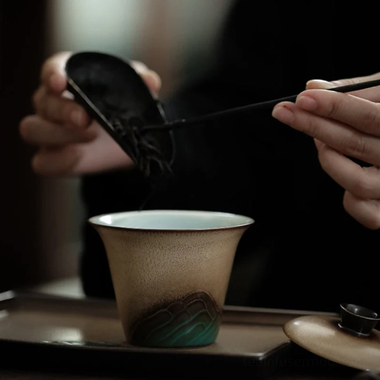 matching mountain design tasting cup on tea tray